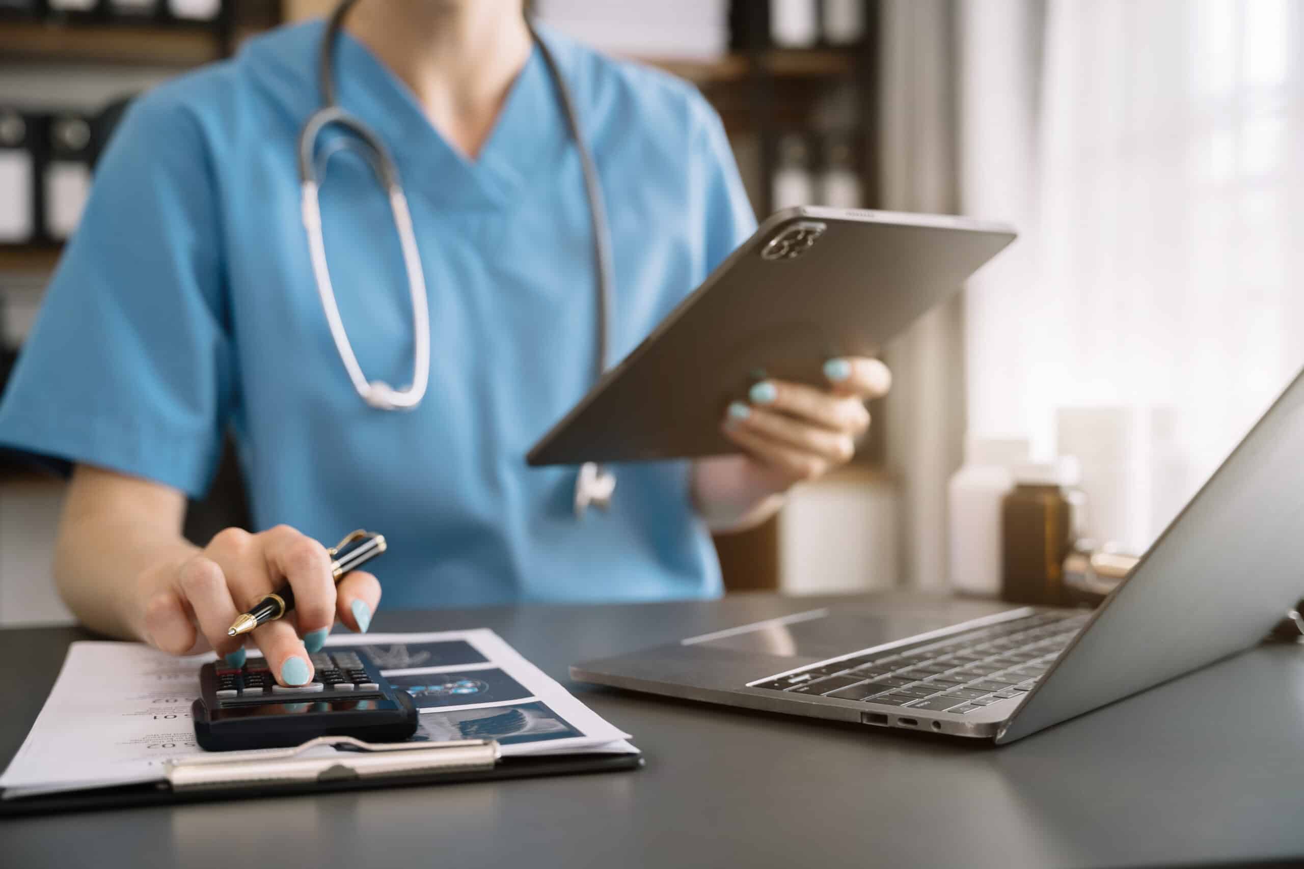 Doctor use a service fee calculator to save money on health insu